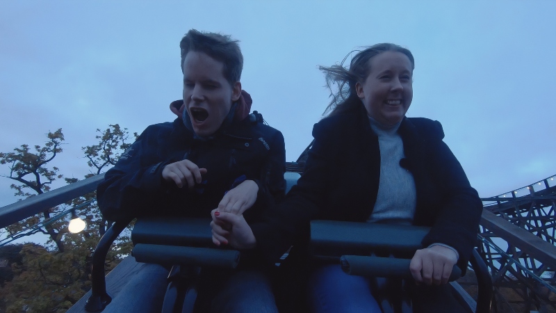 A blind woman and a man ride a rollercoaster