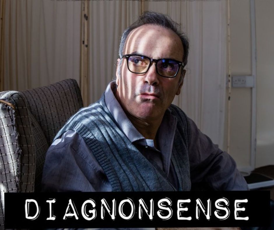 A man wearing glasses sits in a dimly lit room, looking to the side. The word DIAGNONSENSE is written in bold letters at the bottom.